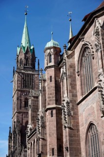 Gothic cathedral with high towers and decorated façade under a clear sky, Church of St Lawrence,