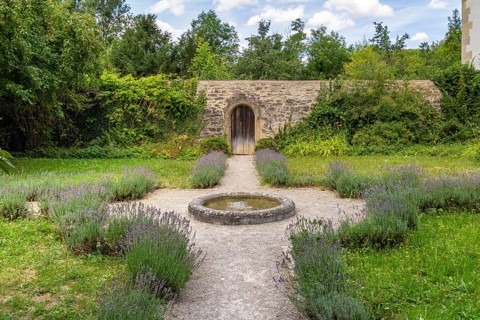 Idyllic park at the Schoental Abbey located in Hohenlohe, a area in Southern Germany at summer time