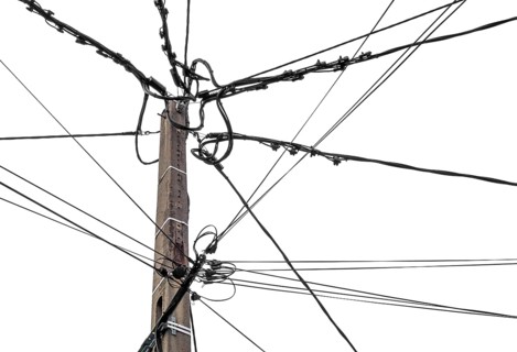 Top of a wooden utility pole isolated in white back
