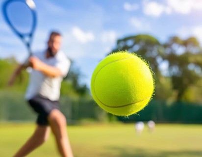 AI generated image showing a flying tennis ball closeup and player in court ambiance