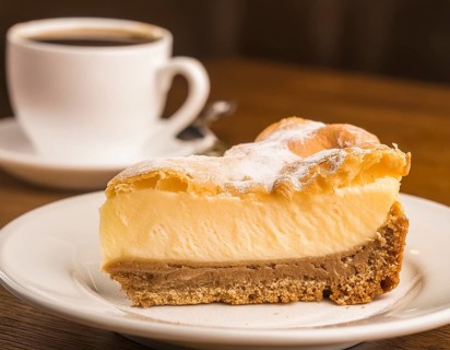Piece of cake on a plate in coffee-table ambiance, AI generated image