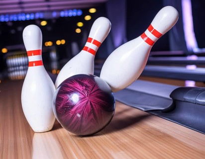 AI generated image showing a closeup bowling scenery with ball and pins