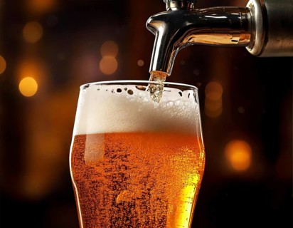AI generated closeup image showing a beer tap while pouring beer in a glass