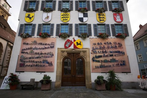 Historical depiction of a folk festival procession, coat of arms, at the town hall, Bad Cannstatt,
