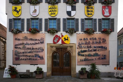 Historical depiction of a folk festival procession, coat of arms, at the town hall, Bad Cannstatt,