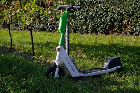 E-scooter, electric scooter, scooter parked in the vineyard next to vines, in the bike rental of