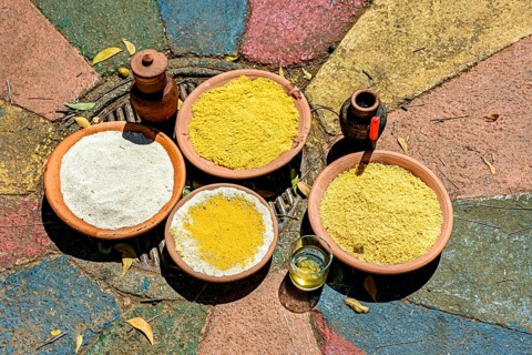 Food on a clay plate being offered to Exu in an Umbanda and Candomble ceremony