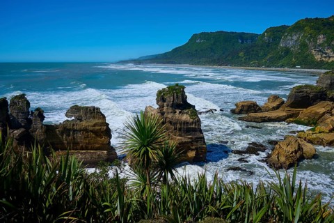 Coastal landscape with rocks, lush vegetation and sweeping sea views, Pancake Rocks, Westport,