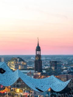 Aerial view of the Elbphilarmonie with St Michael's Church and Hamburg Bunker in the background at