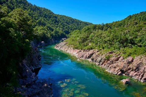 River flows through rocky gorge, surrounded by green nature, Buller River, Murchison, Tasman, South