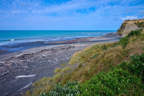 Wide coastal view with imposing cliffs, calm sea and cloudy sky, Mana Bay, Riverview Lookout,