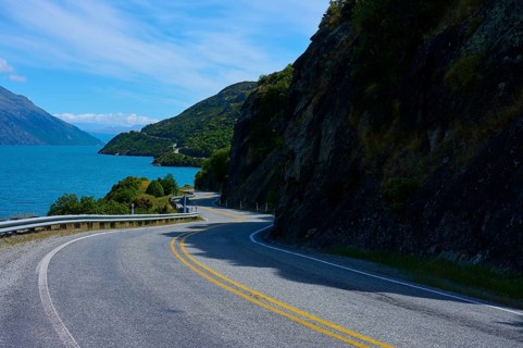 Winding road leads through remote landscape along a lake, Devil's Staircase Lookout Point,