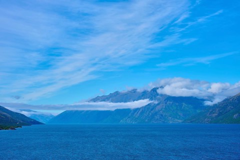 Tranquil landscape with mountains, blue lake and slightly cloudy sky, Drift Bay, Lake Wakatipu,