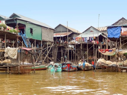 Traditional settlement with wooden houses at the Tonle Sap river in Cambodia