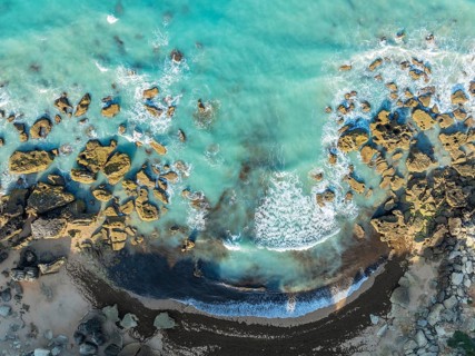 The Roche coves at he Mediterranean Sea. Aerial view. Drone shot. Cádiz province, Andalusia, Spain