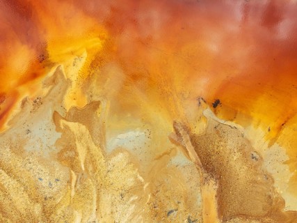 Abstract patterns in a pool in the mineral-rich area of the Rio Tinto mines. The colour is caused