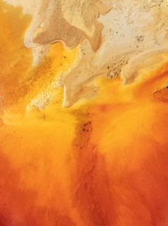 Abstract patterns in a pool in the mineral-rich area of the Rio Tinto mines. The colour is caused