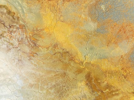 Abstract patterns in a waste pond in the mineral-rich area of the Rio Tinto mines. The colour is