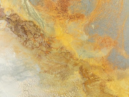 Abstract patterns in a waste pond in the mineral-rich area of the Rio Tinto mines. The colour is