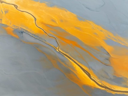 Abstract patterns in a waste pond in the mineral-rich area of the Rio Tinto mines. The colour is
