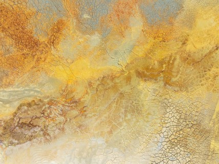 Abstract patterns in a waste pond in the mineral-rich area of the Rio Tinto mines. The colour is