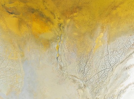 Abstract patterns in a waste pond in the mineral-rich area of the Rio Tinto mines. The colour is