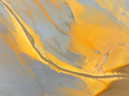 Abstract patterns in a waste pond in the mineral-rich area of the Rio Tinto mines. The colour is