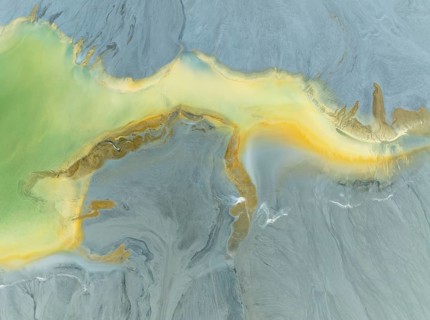 Abstract patterns in a waste pond in the mineral-rich area of the Rio Tinto mines. The colour is