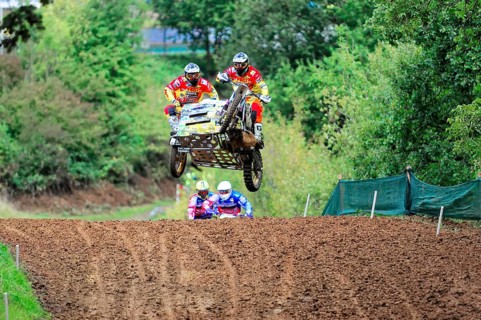 Motocross, Rudersberg, Baden-Württemberg, Germany, Europe, Rider team flies with a motorbike with