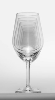 Some clean and empty wine glasses standing in a row in light grey back