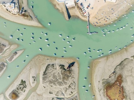 Fishing boats at low tide at the fishing village of Sancti Petri. In the marshland of the Bahía de