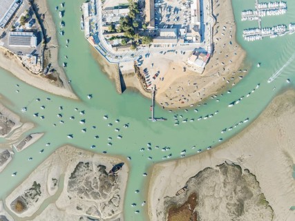 Fishing boats at low tide at the fishing village of Sancti Petri. In the marshland of the Bahía de