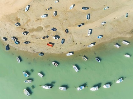 Fishing boats at low tide at the fishing village of Sancti Petri. In the marshland of the Bahía de