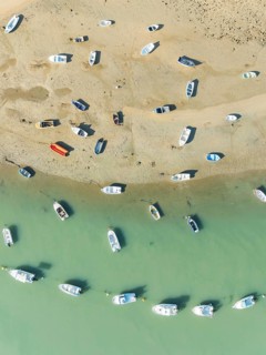 Fishing boats at low tide at the fishing village of Sancti Petri. In the marshland of the Bahía de
