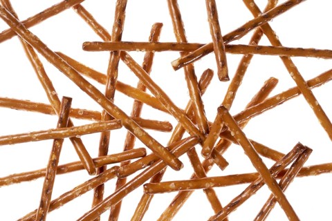Closeup of some crossed salt sticks in white back