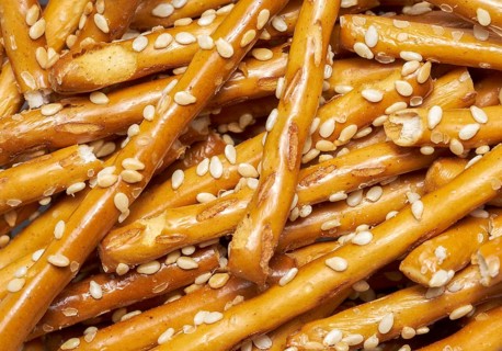 Full frame closeup of some baked sesame sticks