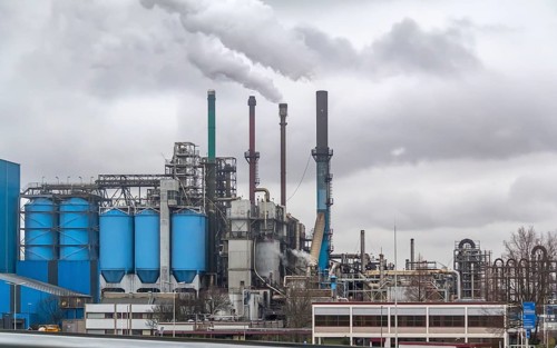 Industrial roadside scenery including a fabric and refinery