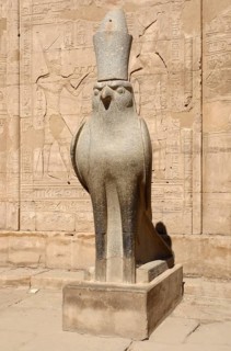 Sunny illuminated scenery including a statue of Horus at the ancient Temple of Edfu in Egypt