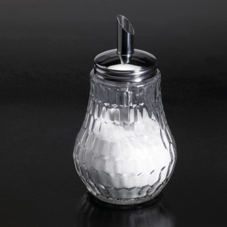 Studio photography of a sugar sprinkler made of glass and metal in dark reflective back