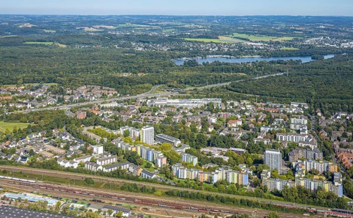 Aerial view, residential area district Hassels with high-rise buildings and view to Unterbacher