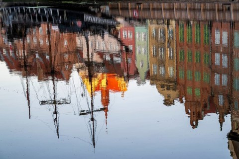 Waterfront promenade with reflection at sunrise in the Old Town, Motlawa River, Gdansk, Gdansk,