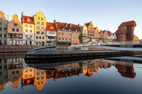 Waterfront promenade with reflection at sunrise in the Old Town, Motlawa River, Gdansk, Gdansk,