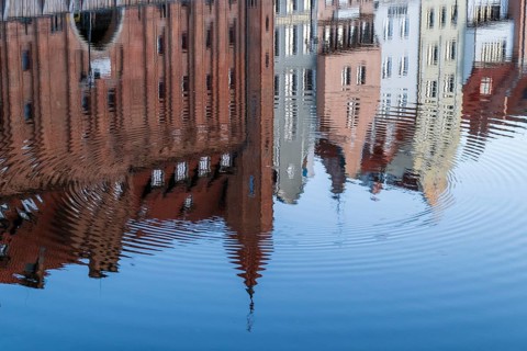 Waterfront promenade with reflection at sunrise in the Old Town, Motlawa River, Gdansk, Gdansk,