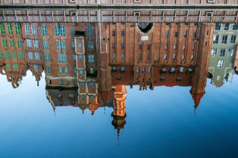 Waterfront promenade with reflection at sunrise in the Old Town, Motlawa River, Gdansk, Gdansk,