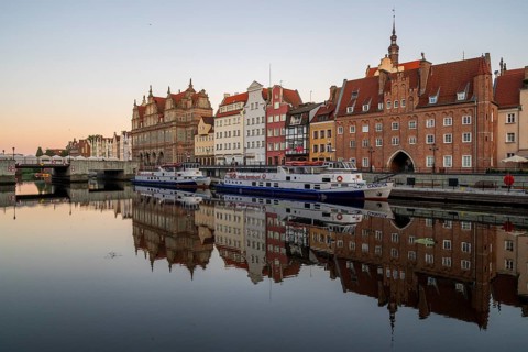 Waterfront promenade with reflection at sunrise in the Old Town, Motlawa River, Gdansk, Gdansk,