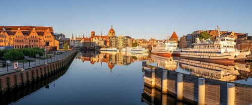 Waterfront promenade with reflection at sunrise in the Old Town, Motlawa River, Gdansk, Gdansk,
