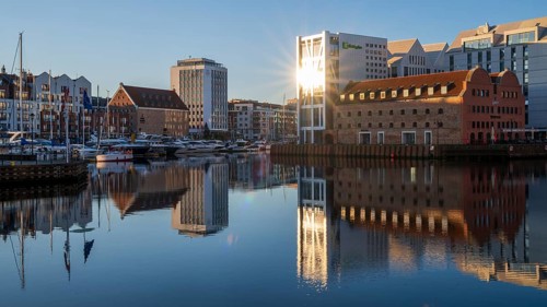 Waterfront promenade with reflection at sunrise in the Old Town, Motlawa River, Gdansk, Gdansk,
