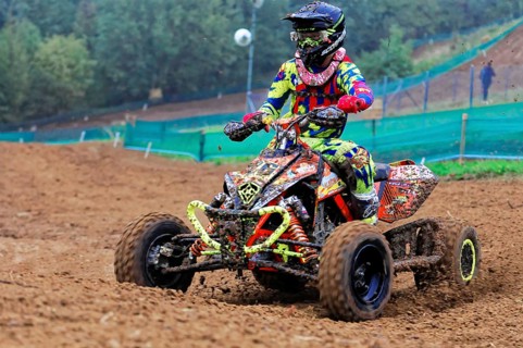 Motocross, Rudersberg, Baden-Württemberg, Germany, Europe, Colourful quad bike rider rides through
