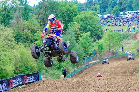 Motocross, Rudersberg, Baden-Württemberg, Germany, Europe, A quadbike drives in the air over a