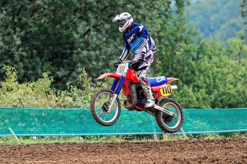 Motocross, Rudersberg, Baden-Württemberg, Germany, Europe, A rider dressed in blue jumps with his